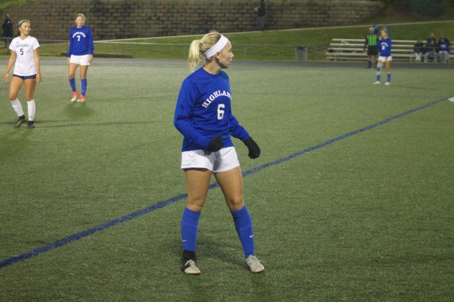 Senior Gwen Gorman prepares for the upcoming match between Highlands High School and the Boone County Rebels. 