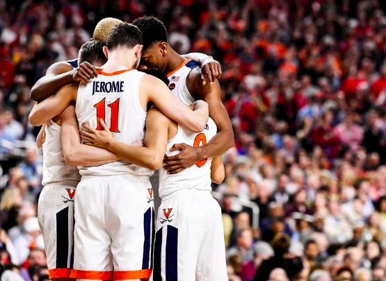 Picture from Sports Illustrated- The Virginia basketball team bands together, hoping for a great game.