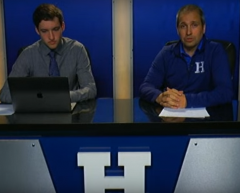 Principal Matthew Bertasso and Senior Nick Fischer address the students during a live broadcast.
