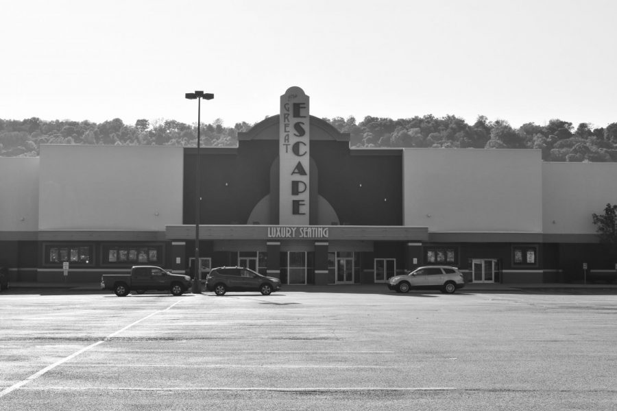 The Regal Wilder movie theatres parking lot is empty, save for the cars of a few employees. 