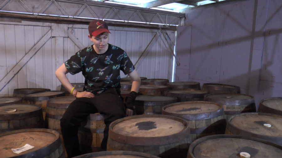 Bredwell sits on top of the extensive barrel collection in her warehouse.