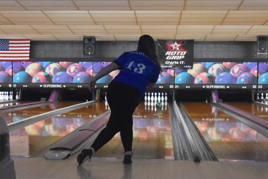 The anchor of the team, Senior Abby Bach, rolls the bowling ball down the lane.