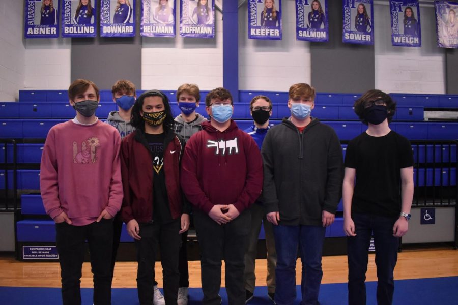 Esports club members (from left to right) Seniors Matthew Young, Sterling Frink, Pu lin Thumrongthaisakul, Michael Queen, Junior Mason Stull, Senior Tyler Sandmann, Junior Zach Fisher, Sophomore Jack Clinkinbeard, and Senior Michael Mulligan [not pictured] stand together for their club picture.