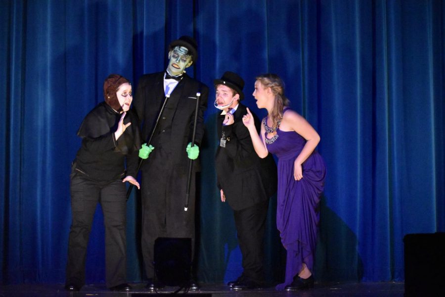 Igor (sophomore Grace Shuley), the Monster (sophomore Logan Holbrook), Dr. Frederick Frankenstein (senior Hank Slaby), and Inga (senior Zoe Zoller) put on a show for Transylvania. 