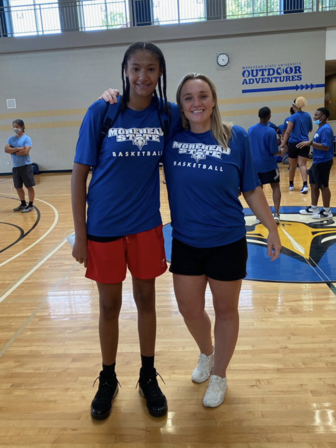 Standing+with+the+coach+who+offered+her+the+first+scholarship%2C+Freshman+Marissa+Green+takes+a+quick+picture+with+Cayla+Petree%2C+the+Head+Women%E2%80%99s+Basketball+Coach+at+Morehead+State+University.+