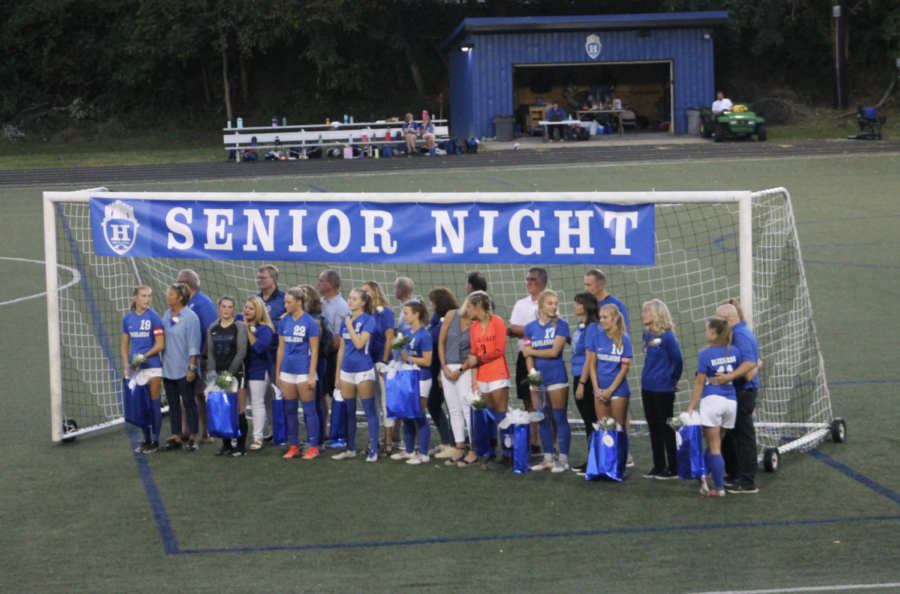 The seniors converse with their parents and friends during the Senior Night ceremony. 