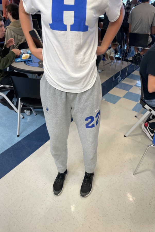 Junior Carly Cramer shows off her sweatpants given to her by the softball team.