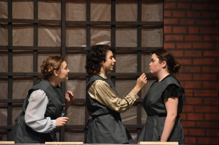 Sophomore Samantha Heilman and Seniors Erica Kruse and Grace Shuley interact with one another, playing the three main Radium Girls, Catherine, Irene, and Grace Fryer.