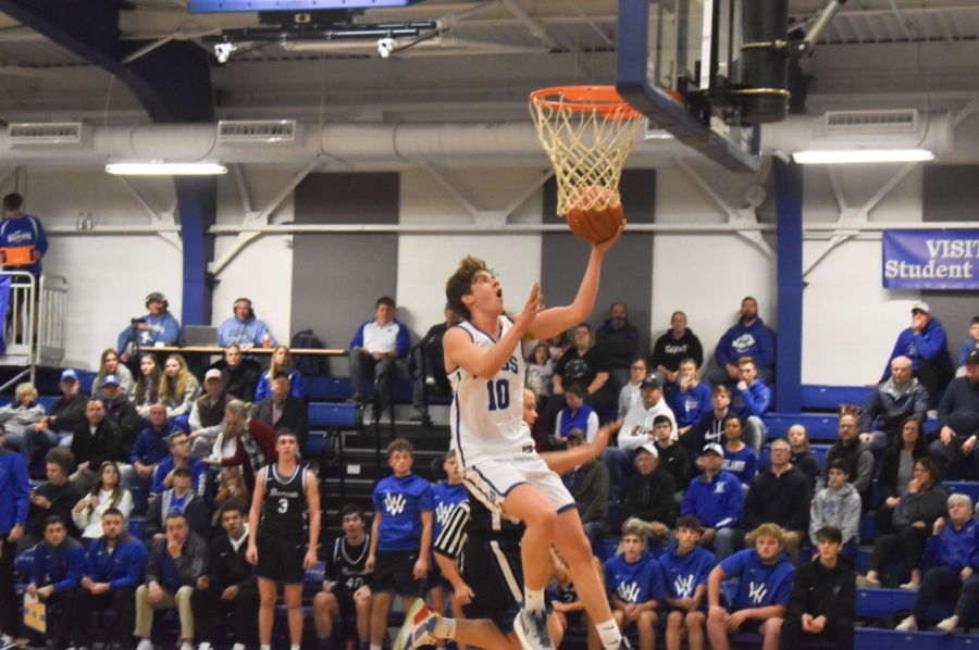Senior Zachary Barth goes in to shoot a lay-up.