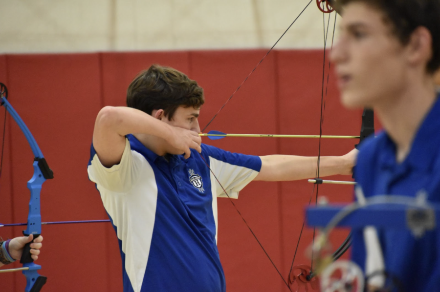 Senior Quinton Wehby focuses while aiming for the target during an archery practice from last year.