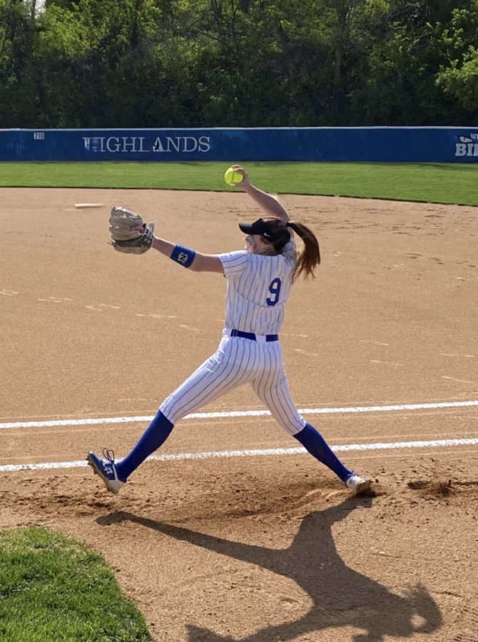 Senior Kennedy Baioni practices her pitching pre-game.