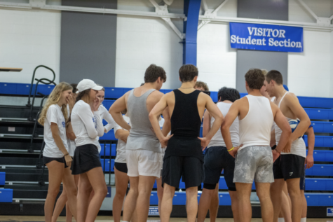 The seniors huddles together during the beefcake championship and makes a game plan.