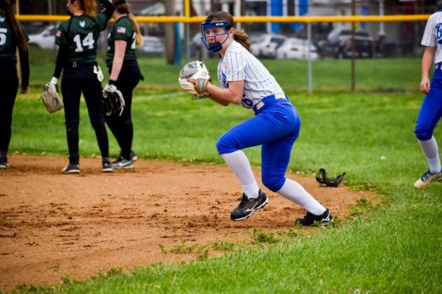 Eighth-grader Cam Markus warms up with the infield before the game.