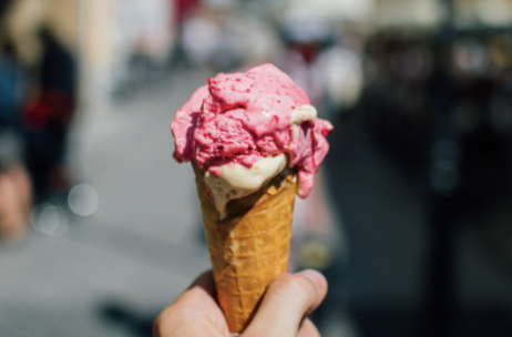 Someone holding an ice cream cone.