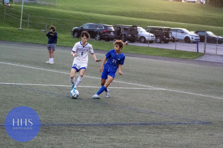 Junior Chad Gesenhues passes the ball to his teammate. 