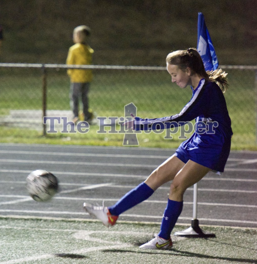 Junior Alli Sower kicks the corner kick.
