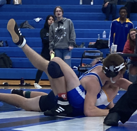 Freshman Caleb Hudson pin his opponent taking his first win ever!