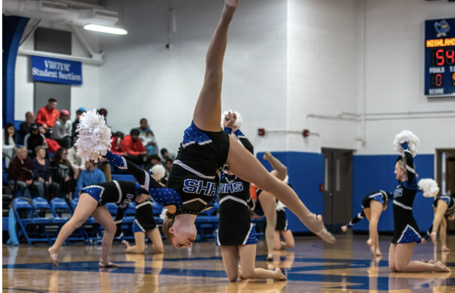 Sophomore, Shelby Shields does an ariel during halftime performance.