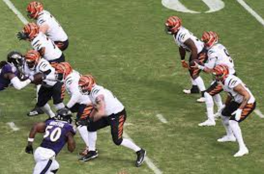 Joe Burrow preparing to snap the ball, courtesy of Wikimedia Commons.