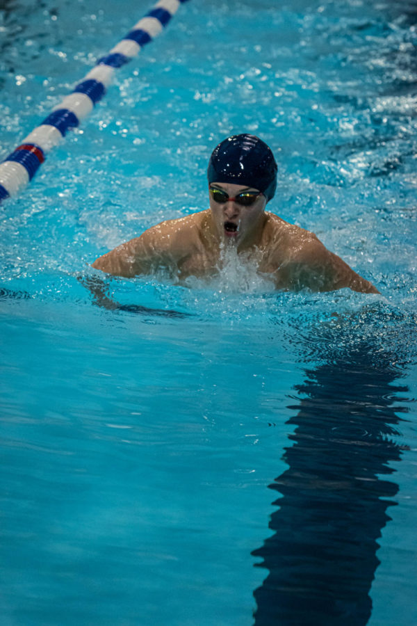 Freshman+Chase+Pawsat+comes+up+for+air+while+swimming+breaststroke+at+the+Conference+meet.