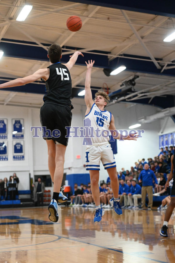 Senior William Herald floats the ball up over the big man.