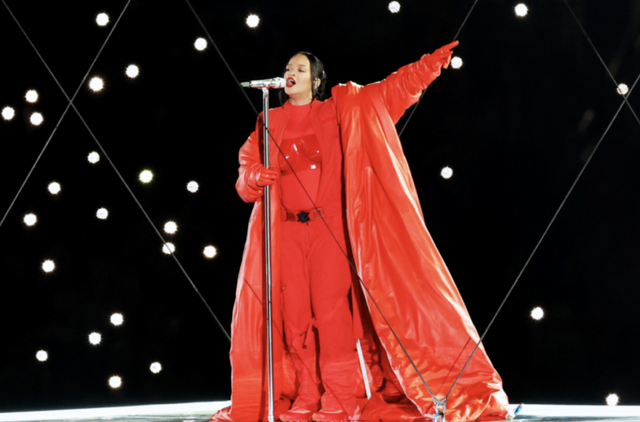 Rihanna on stage in the air performing at the 2023 Super Bowl. 