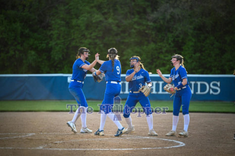 Senior Carly Cramer and Kennedy Baioni, and Freshmen Payton Brown and Morgan Pompilio celebrate after getting a batter out.