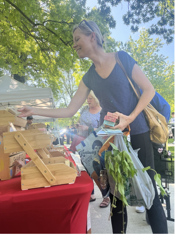 Erin Peabody shops for the high in-demand baked goods at the annual Wednesday Ft. Farmers Market. 
 
