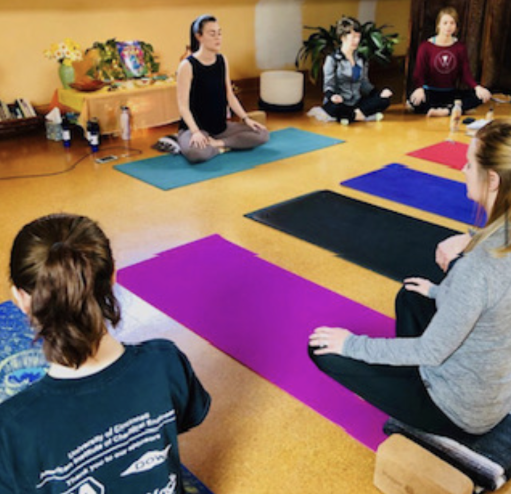 English Teacher Laura Taylor is pictured here instructing a yoga class.