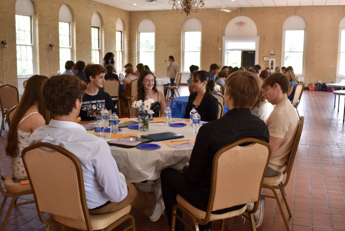 Inductees Treiston Collins, Lily Arnberg, and Cal Lacourt, share a laugh during their discussion. 
