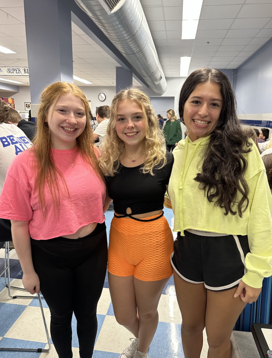 Sophomores Lexi Zins, Sophia French, and Sophia Cabellero stand up and show off their neon. French said, Our future is as bright as our clothes.