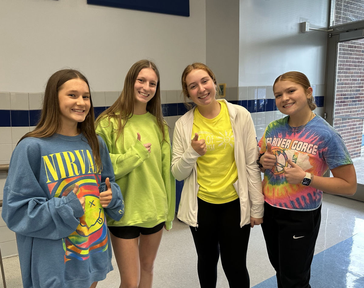 Juniors Ella Cunningham, Morgan Herald, Jenna Richey, and Sophomore Madison Barlow all give thumbs ups for the neon. Richey said, Neon day was fun to dress up for and Im excited to do the other themes in the upcoming week.