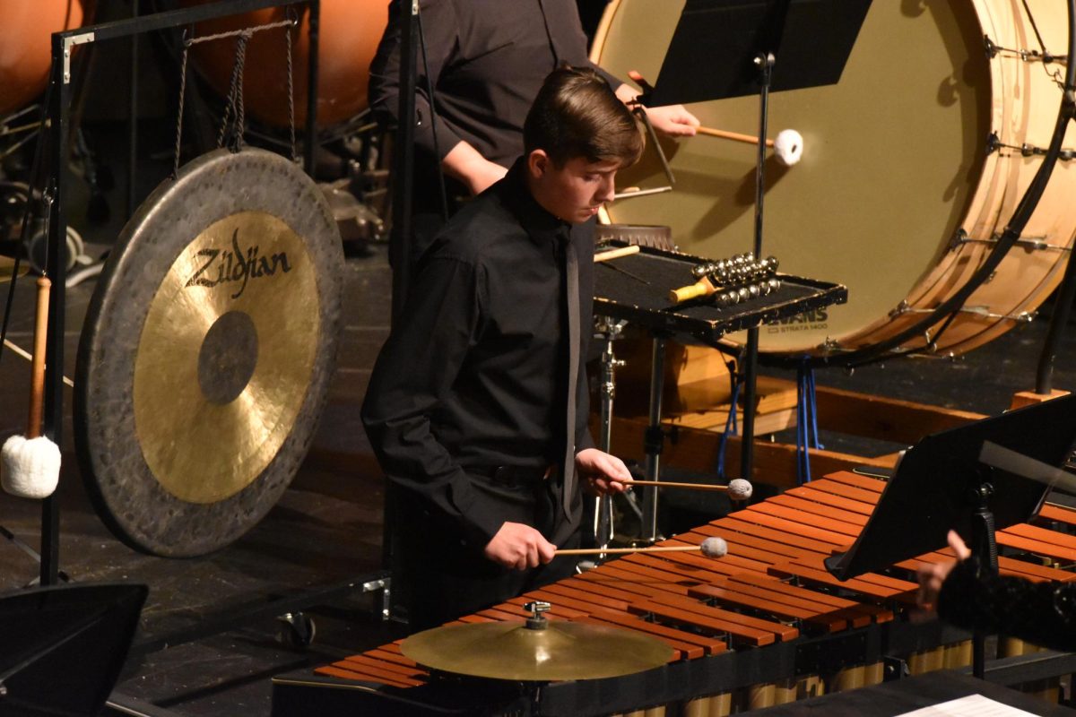 Freshman Parker Gay plays the mallets at the band concert.