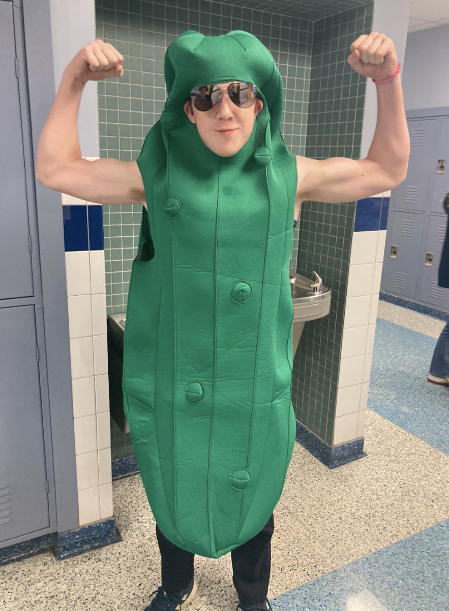 Sophomore Caleb Hudson flexes while being a pickle.