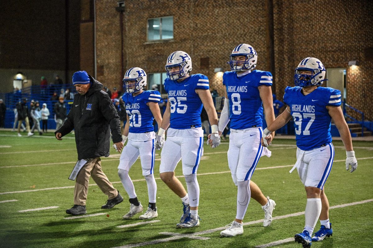 Seniors Nate Welch (20), Luke Schneider (85), Brody Benke (8), and Carson Shelton (97) walk up for captions