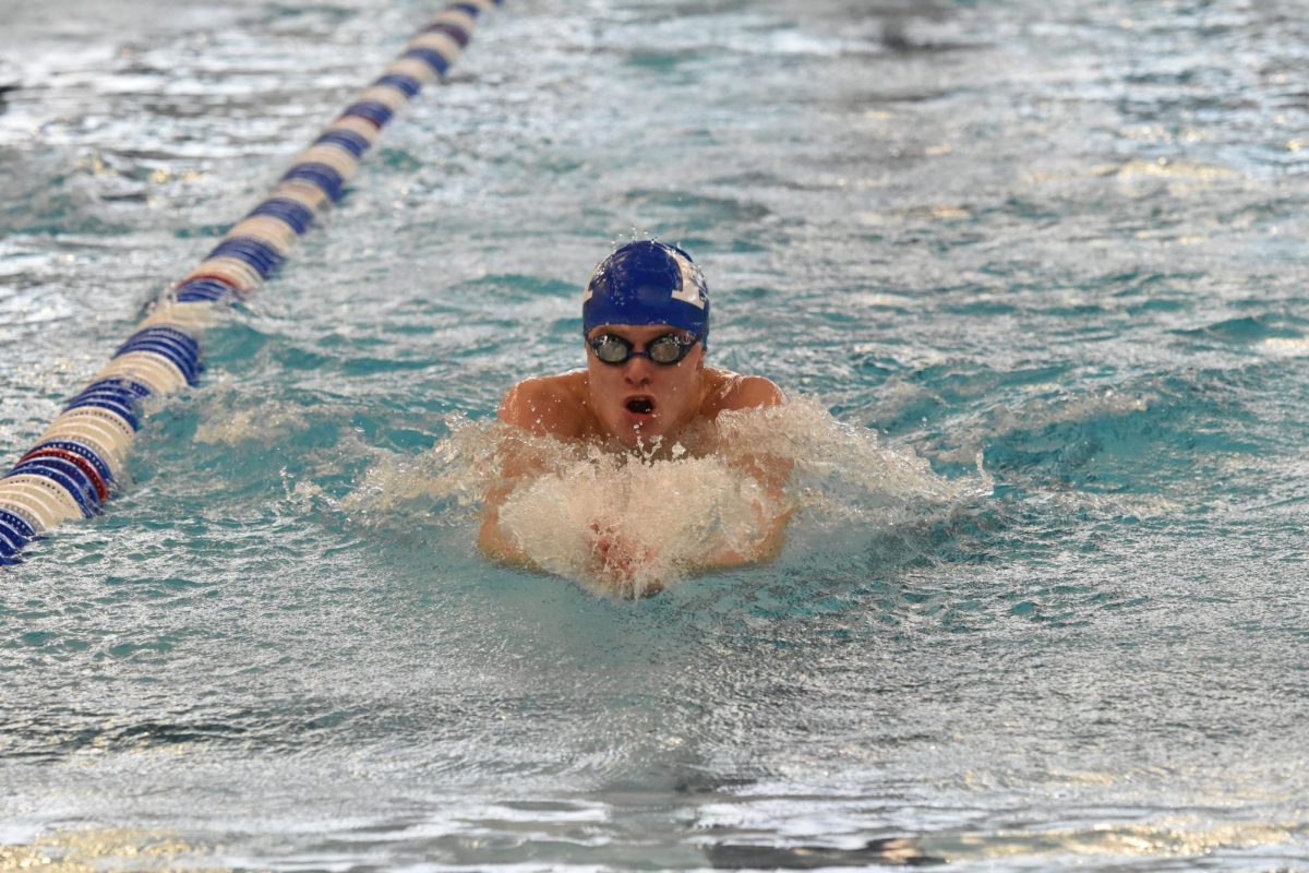 Junior Griffin Barlow takes a lead in the 100 breaststroke.