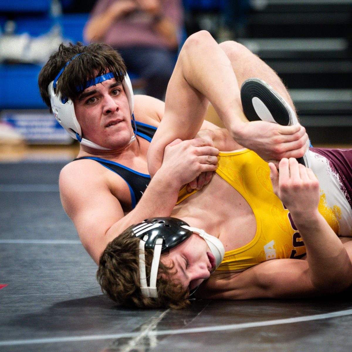 Senior Tyler Parks tries to keep his grip on the Cooper wrestler.