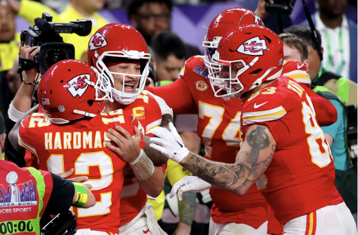 Patrick Mahomes hugs Mecole Hardman in the end zone after throwing the winning touchdown of Super Bowl 58 on February 11th. 
