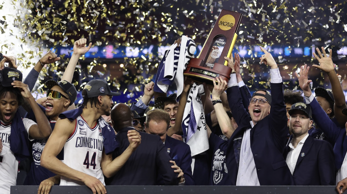 UConn+celebrates+after+a+big+win+at+the+NCAA+college+basketball+tournament+in+2023.