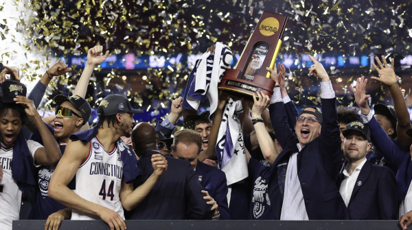 UConn celebrates after a big win at the NCAA college basketball tournament in 2023.