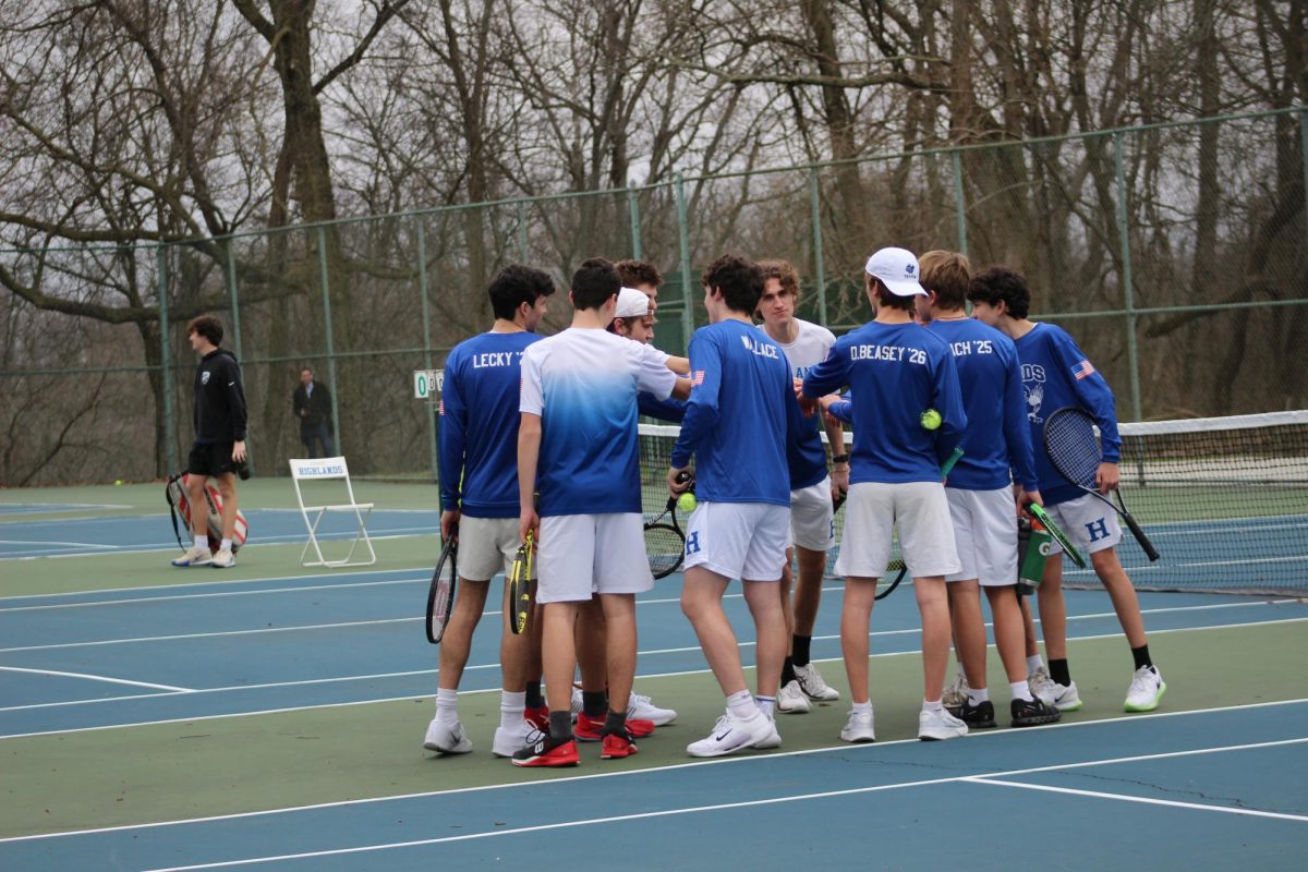 Senior+Eli+Back+leads+his+team+in+the+huddle+as+they+begin+to+play+against+Simon+Kenton_