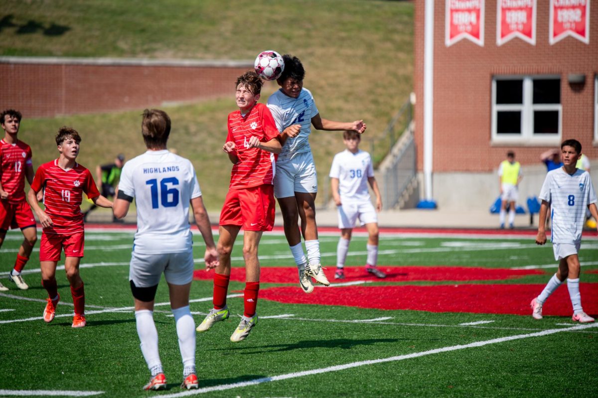 David Valdez (9) goes up against a Beechwood player for possession of the ball.