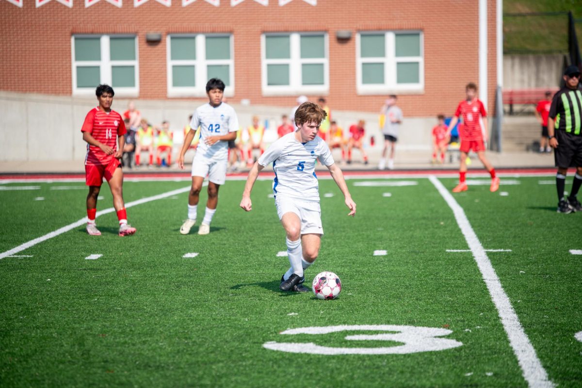 John Exterkamp (12) receives a pass from his teammate. 