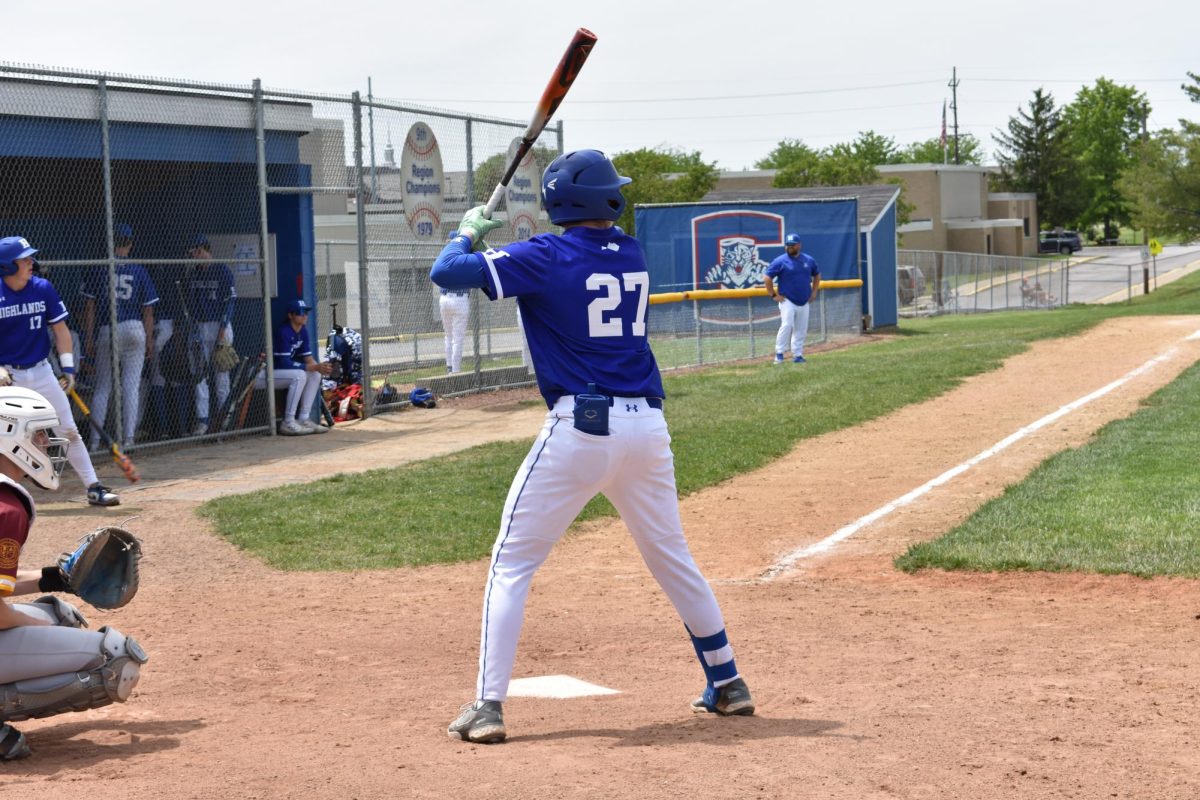 Braden Glaser (10) steps into his batting stance and prepares to hit.