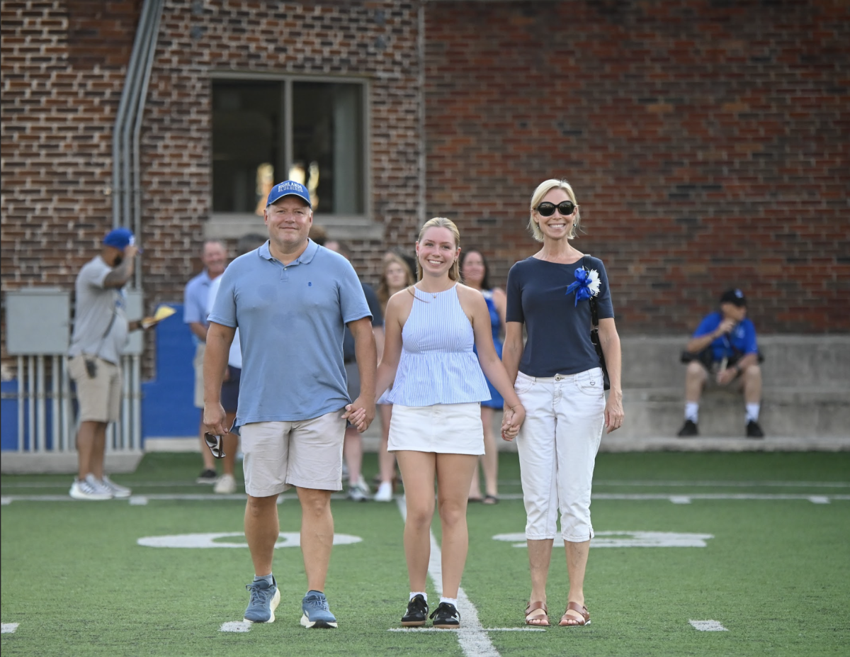 Ella Peabody (12) with her parents Erin and Ryan Peabody.