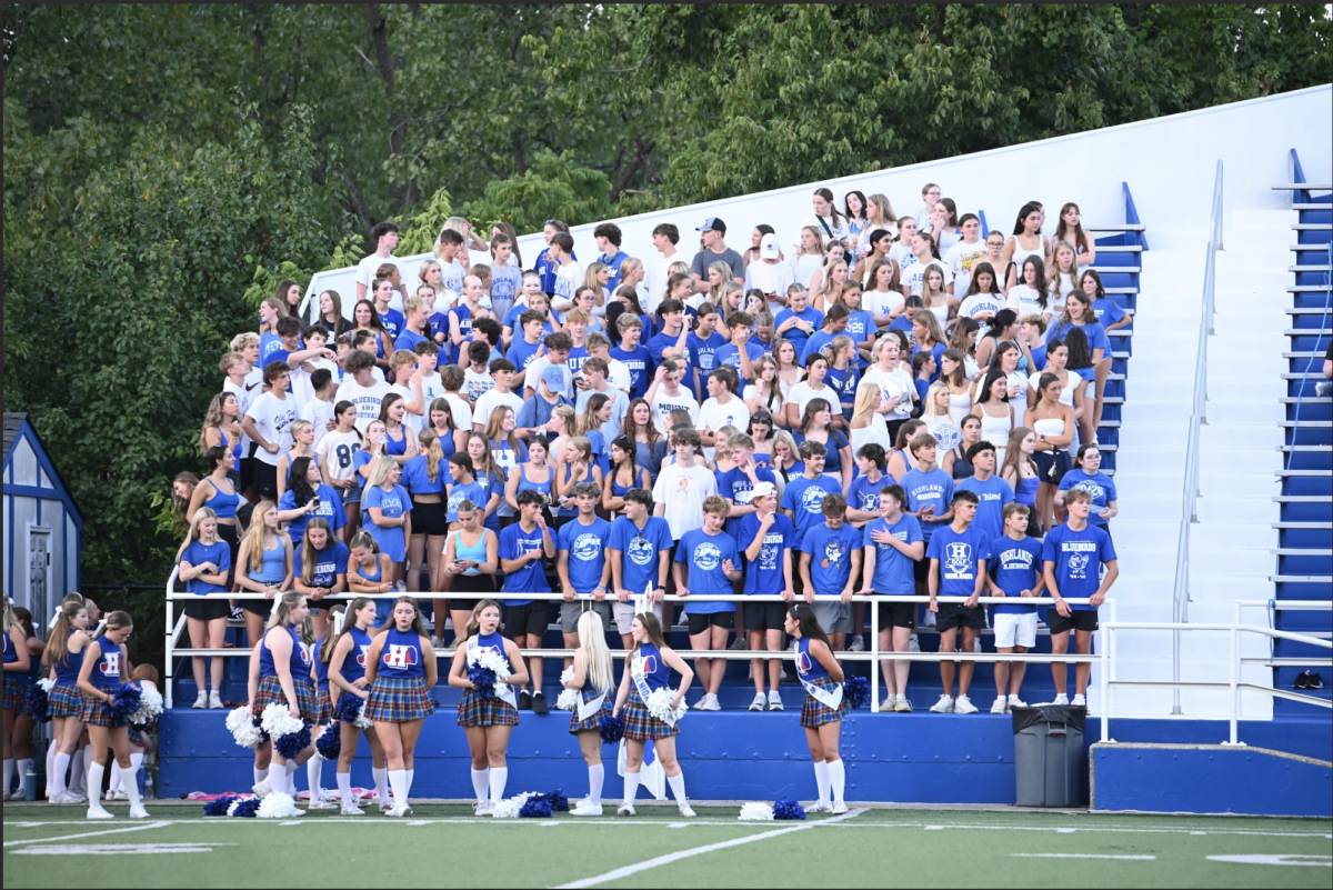 The Highlands High school students show up and cheer for both the blue and white players.  "I love coming to games and supporting my peers, and hanging out with my friends." said  Mirabelle Go (10)