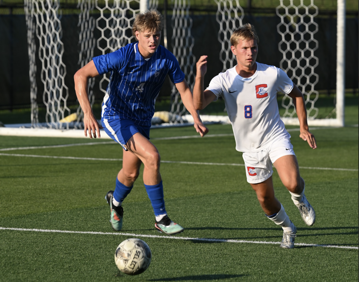 Orion Scully (11) runs to secure control of the ball.