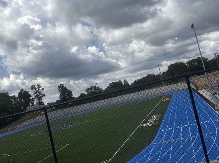 Hope Darnell (10) showing the current progress of the Highlands High School soccer field.