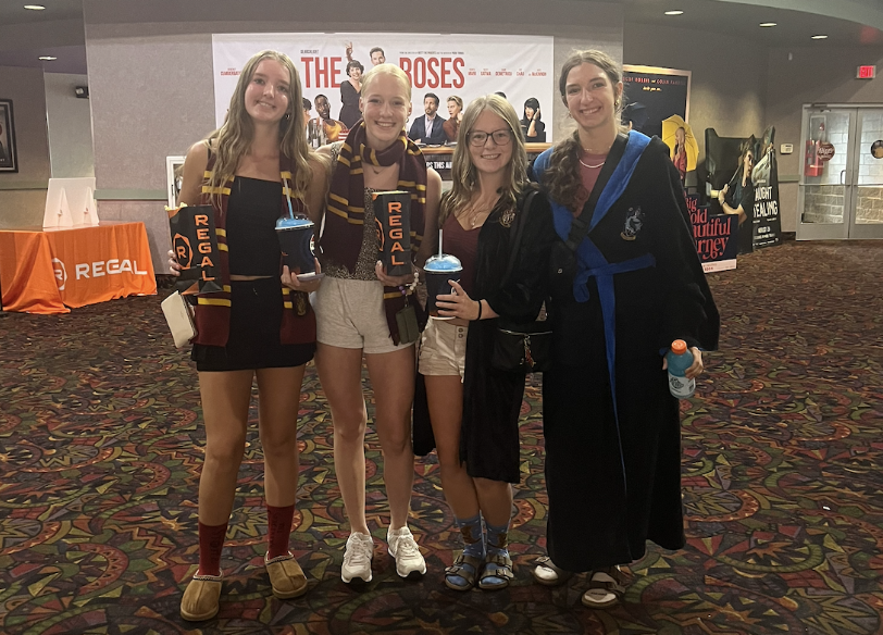 Natalie Abdon (10), Stella Taylor (10), Caroline Palicki (10), and Elizabeth Krueger (10) pose before the movie. Photo taken by Kristin Krueger