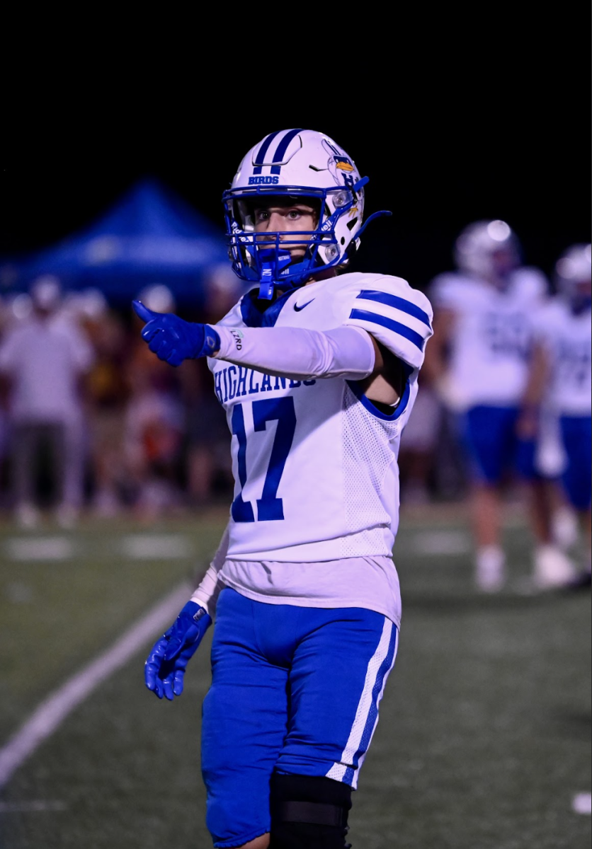 Ian Garrahan (12) aligns on the line of scrimmage for the next play.